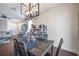 Dining area with view into the living room, featuring modern table and chairs at 9706 Simeon Dr, Land O Lakes, FL 34638