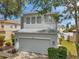 Two-story home with neutral paint, an attached two-car garage, and manicured landscaping at 9706 Simeon Dr, Land O Lakes, FL 34638