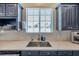 Modern kitchen sink boasts stainless fixtures and countertop at 9706 Simeon Dr, Land O Lakes, FL 34638