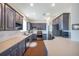Spacious kitchen features modern appliances, bright white countertops, backsplash and cabinetry at 9706 Simeon Dr, Land O Lakes, FL 34638