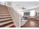 Open floor plan leads to a living area with large screen tv at 9706 Simeon Dr, Land O Lakes, FL 34638