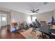 Open music room with musical instruments and a ceiling fan at 9706 Simeon Dr, Land O Lakes, FL 34638