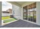 View of the patio with a putting green and sliding glass doors to the home at 9706 Simeon Dr, Land O Lakes, FL 34638