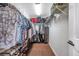 Walk-in closet with wood-look floors, wire shelving, and ample storage space at 9706 Simeon Dr, Land O Lakes, FL 34638