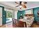 Bedroom with a view to the backyard pool area through sliding glass doors at 10924 Archway Ave, Hudson, FL 34667