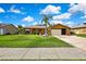 Charming home featuring a well-maintained front yard and attached garage at 10924 Archway Ave, Hudson, FL 34667