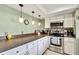 A view of the kitchen, featuring stainless appliances and ample counter space at 10924 Archway Ave, Hudson, FL 34667