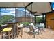 Inviting screened patio with outdoor seating and bar area, providing a great space for relaxation and entertainment at 10924 Archway Ave, Hudson, FL 34667