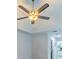 This bedroom has carpet and a ceiling fan at 10060 Chip Ln, New Port Richey, FL 34654