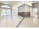 Bright and airy living room with tile flooring, pool views, and an open floor plan at 10060 Chip Ln, New Port Richey, FL 34654
