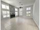 Bright living room features tile floors, fireplace, shutters, and a ceiling fan at 10060 Chip Ln, New Port Richey, FL 34654