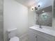 Modern bathroom featuring a new vanity, mirror and hardware at 10097 Weatherly Rd, Brooksville, FL 34601