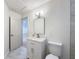 Modern bathroom featuring a vanity, mirror and a new toilet at 10097 Weatherly Rd, Brooksville, FL 34601