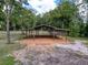 A substantial three-bay carport providing ample covered parking or storage space on the property at 10097 Weatherly Rd, Brooksville, FL 34601
