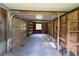 Bright, open interior of garage showcasing shelving and natural light from window at 10097 Weatherly Rd, Brooksville, FL 34601
