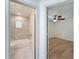 Hallway view showcasing entry door to bedroom and bathroom at 10097 Weatherly Rd, Brooksville, FL 34601