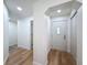 Hallway with hardwood floors and doorway at 10097 Weatherly Rd, Brooksville, FL 34601