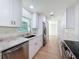 Bright kitchen features stainless appliances, granite counters and undermount sink at 10097 Weatherly Rd, Brooksville, FL 34601