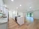 This kitchen overlooks a spacious living area, creating an ideal space for entertaining and Gathering gatherings at 10097 Weatherly Rd, Brooksville, FL 34601