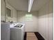 Laundry room includes washer, dryer and utility sink at 10097 Weatherly Rd, Brooksville, FL 34601