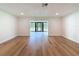 Open living space leads to the outdoor screened in lanai at 10097 Weatherly Rd, Brooksville, FL 34601