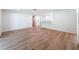 Bright, open living room features wood flooring and recessed lighting at 10097 Weatherly Rd, Brooksville, FL 34601