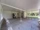 Spacious open patio connects to a screened in porch area at 10097 Weatherly Rd, Brooksville, FL 34601