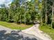 An impressive view showing the private, long driveway on the property at 10097 Weatherly Rd, Brooksville, FL 34601