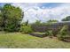 Lush backyard featuring mature trees, a garden bed, and ample green space at 10600 Oleander Dr, Port Richey, FL 34668