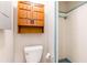 Bathroom featuring a toilet, shower and mirrored medicine cabinet, providing essential amenities at 10600 Oleander Dr, Port Richey, FL 34668