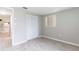 Bedroom with a large closet and window providing natural light and a comfortable space at 10600 Oleander Dr, Port Richey, FL 34668