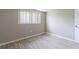 This bedroom offers light grey walls and wood look floors, perfect for customization at 10600 Oleander Dr, Port Richey, FL 34668