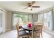 Bright dining room featuring tile floors and large windows at 10600 Oleander Dr, Port Richey, FL 34668