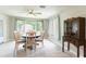 Charming dining room with tile floors and a vintage cabinet at 10600 Oleander Dr, Port Richey, FL 34668