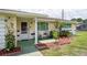 Inviting front porch with decorative plants and comfortable seating area at 10600 Oleander Dr, Port Richey, FL 34668