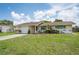 Charming single story home with a well-manicured lawn and front yard at 10600 Oleander Dr, Port Richey, FL 34668