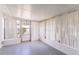 Bright sunroom featuring white walls and sheer curtains for privacy and ample natural light at 10600 Oleander Dr, Port Richey, FL 34668