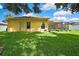 Spacious backyard with a well-maintained lawn, perfect for outdoor activities and entertaining at 11204 Biddeford Pl, New Port Richey, FL 34654