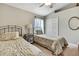 Comfortable bedroom with twin beds, a closet, and neutral decor for a cozy and inviting space at 11204 Biddeford Pl, New Port Richey, FL 34654