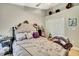 Cozy bedroom featuring neutral tones, a plush bed, and ample storage space in the closet at 11204 Biddeford Pl, New Port Richey, FL 34654