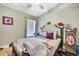 Bedroom boasts natural light and features a bed with decoratively-pillowed headboard at 11204 Biddeford Pl, New Port Richey, FL 34654