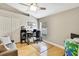 Bedroom offers a desk, closet, and natural light with a ceiling fan at 11204 Biddeford Pl, New Port Richey, FL 34654