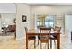 Bright dining area with a view of the screened patio and access to the living room at 11204 Biddeford Pl, New Port Richey, FL 34654