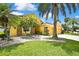 Charming home exterior with a well-manicured front yard and lush landscaping around the base at 11204 Biddeford Pl, New Port Richey, FL 34654
