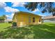 Beautiful home exterior featuring a well-maintained lawn and manicured landscaping around the foundation at 11204 Biddeford Pl, New Port Richey, FL 34654