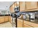 Stylish kitchen featuring granite countertops, stainless steel appliances, and ample cabinet space at 11204 Biddeford Pl, New Port Richey, FL 34654