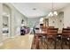 Open concept living room area featuring an archway, tile floors, and a view into the dining room at 11204 Biddeford Pl, New Port Richey, FL 34654