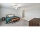 Serene bedroom featuring carpeted floors, a ceiling fan, and neutral wall colors for a relaxing ambiance at 11395 Lavender Loop, Spring Hill, FL 34609