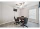 Game room with ceiling fan, television and table with rolling chairs at 11395 Lavender Loop, Spring Hill, FL 34609