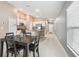 Open-concept dining area showcasing the kitchen with granite countertops and stainless steel appliances at 11395 Lavender Loop, Spring Hill, FL 34609